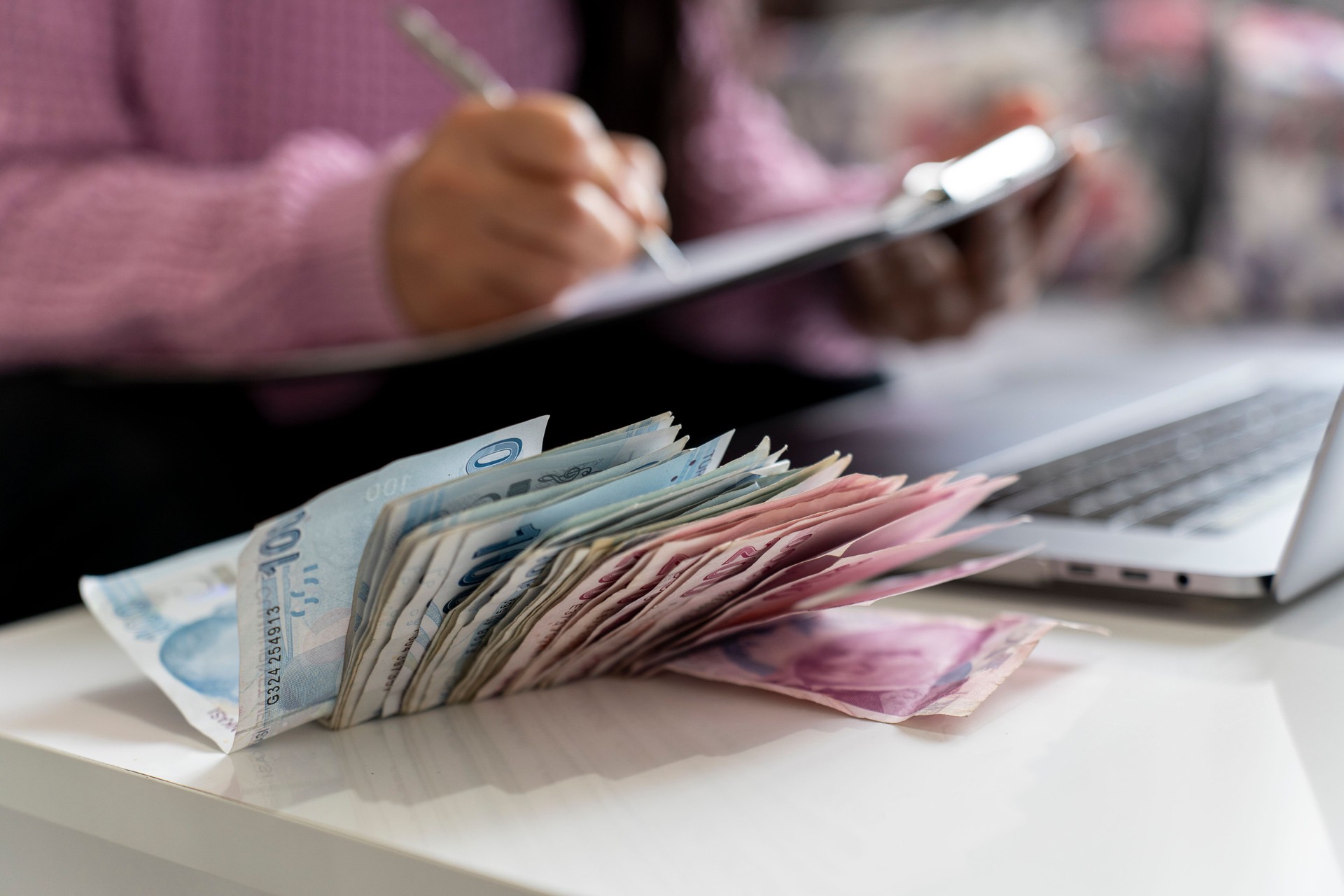 Businesswoman counting Turkish money.